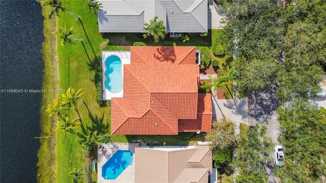 drone / aerial view with a water view