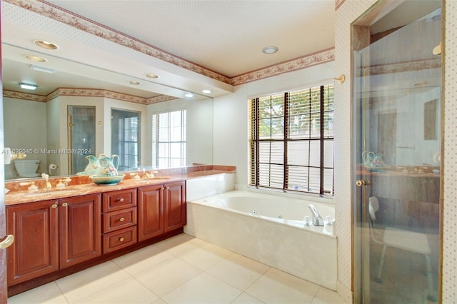 full bathroom with toilet, tile patterned floors, vanity, and separate shower and tub