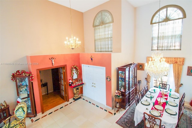 foyer entrance with light hardwood / wood-style floors and an inviting chandelier