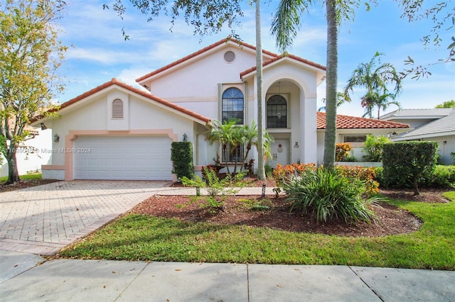 mediterranean / spanish-style house featuring a garage