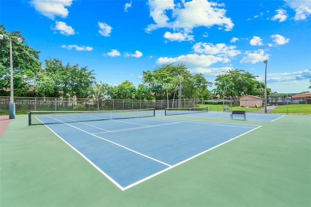 view of tennis court featuring basketball court