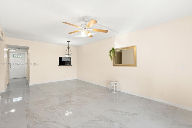 spare room featuring ceiling fan