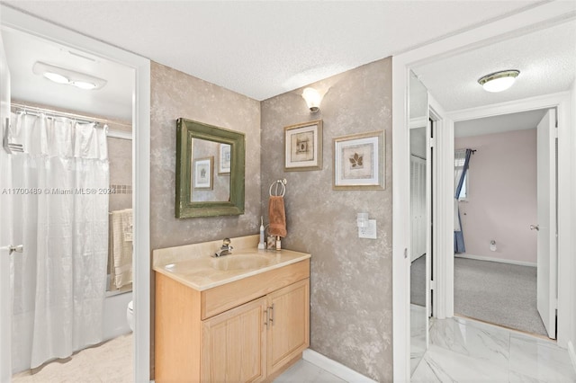 full bathroom featuring vanity, a textured ceiling, toilet, and shower / bathtub combination with curtain