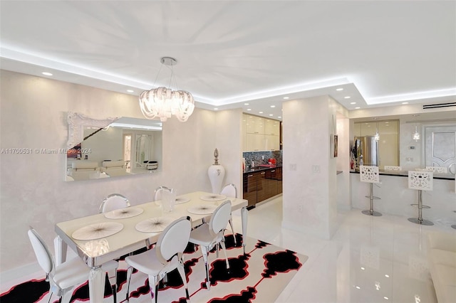 dining room with light tile patterned floors and an inviting chandelier