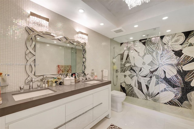 bathroom featuring decorative backsplash, vanity, toilet, and tile walls