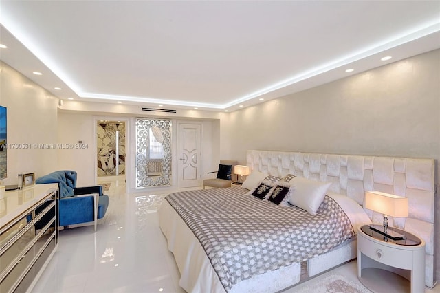 bedroom featuring a raised ceiling