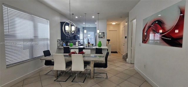 dining space featuring light tile patterned flooring