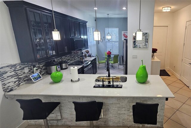 dining room with light tile patterned floors and an inviting chandelier