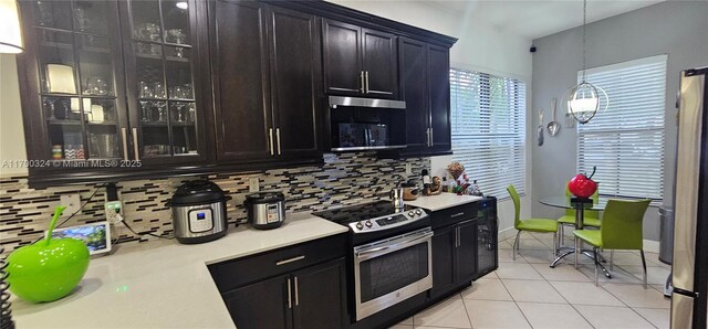 kitchen featuring decorative backsplash and light tile patterned flooring