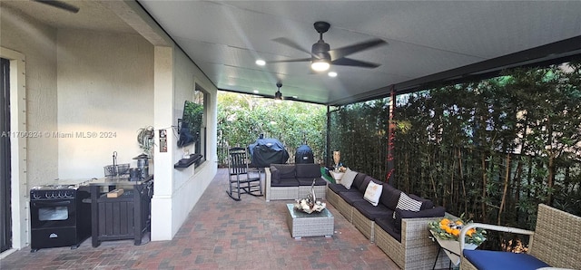 view of patio with outdoor lounge area and ceiling fan