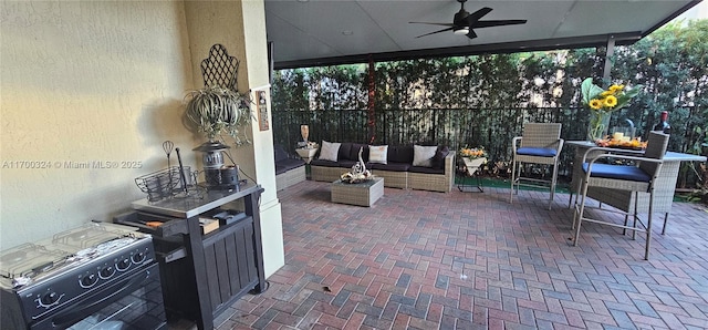 view of patio / terrace with ceiling fan and an outdoor hangout area