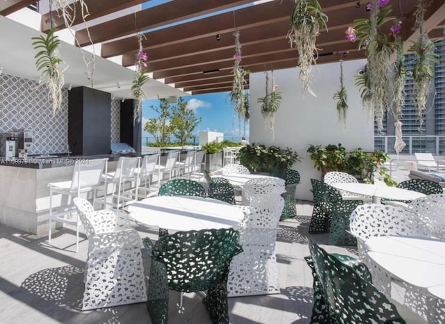 view of patio / terrace with a pergola and a bar