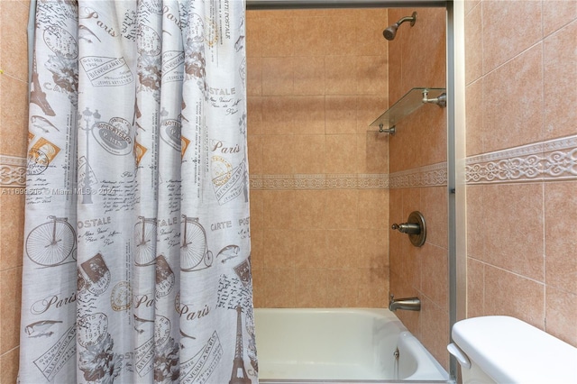 bathroom featuring shower / bath combination with curtain, tile walls, and toilet