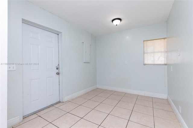 empty room with light tile patterned floors