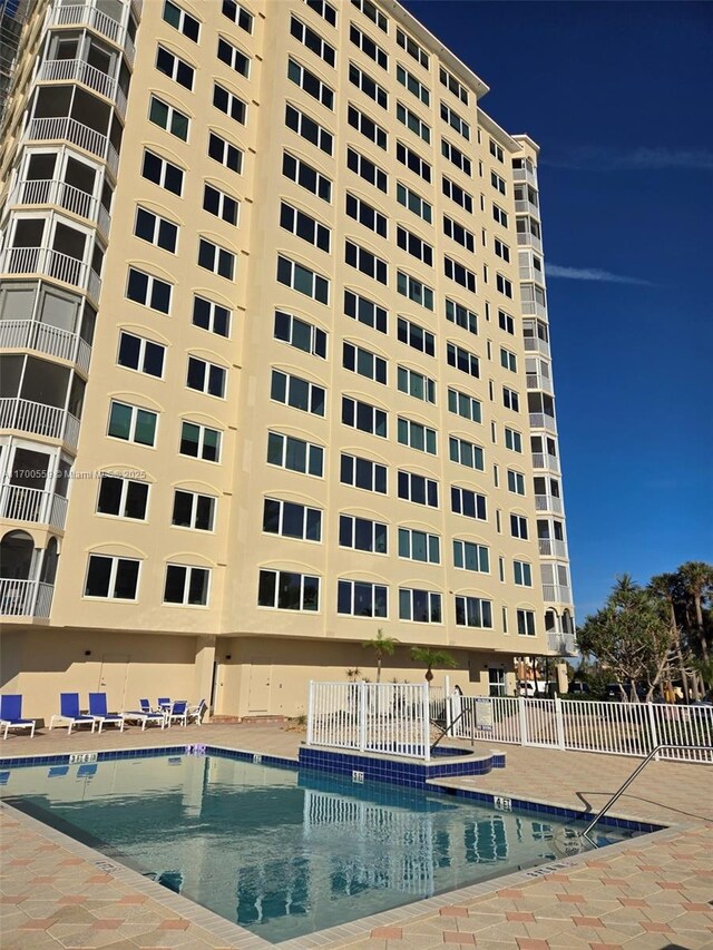 view of property with a community pool