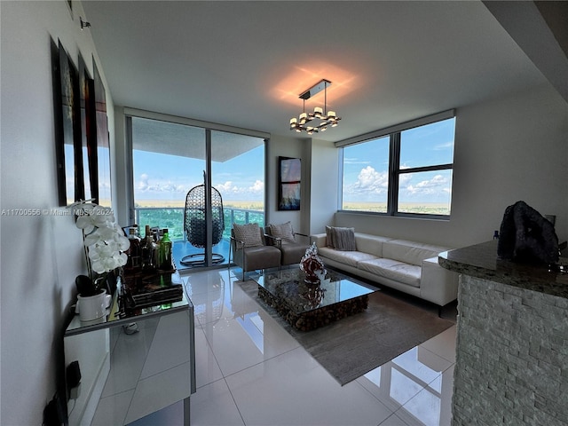 living room featuring expansive windows, light tile patterned floors, and a chandelier