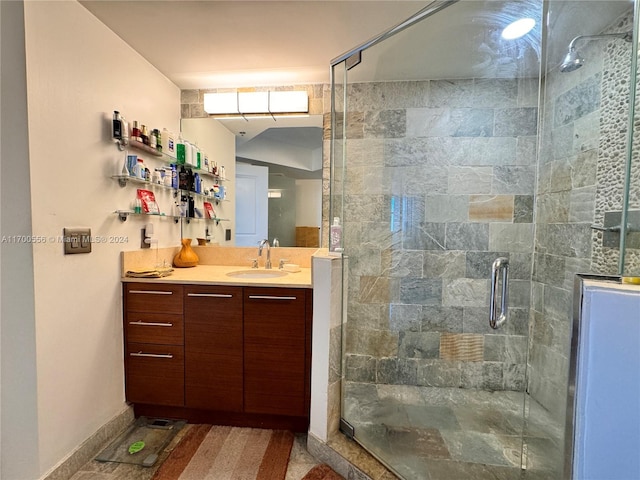 bathroom with vanity and an enclosed shower