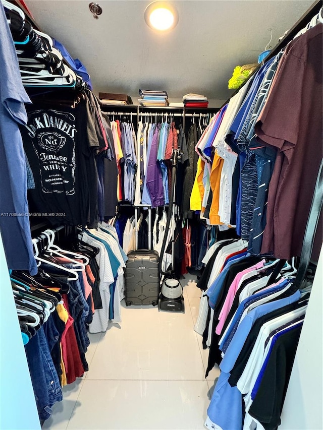 spacious closet featuring tile patterned floors