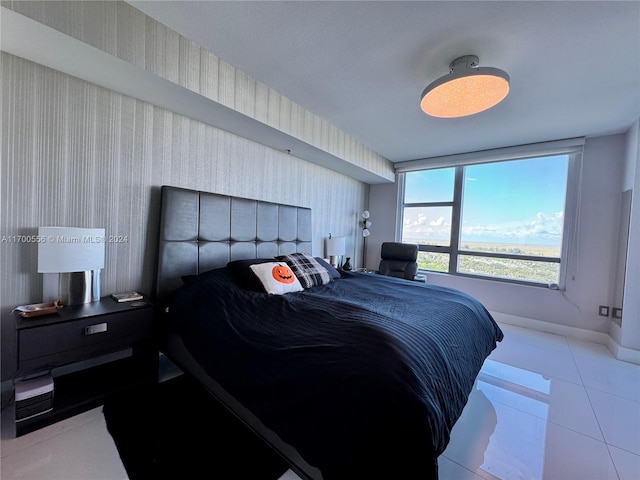 bedroom with light tile patterned floors