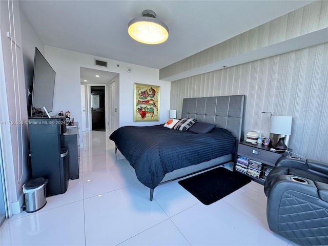 bedroom with light tile patterned floors