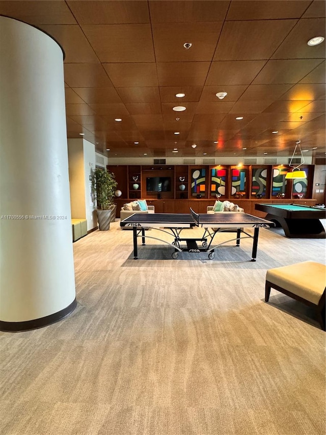 game room featuring light colored carpet and a drop ceiling