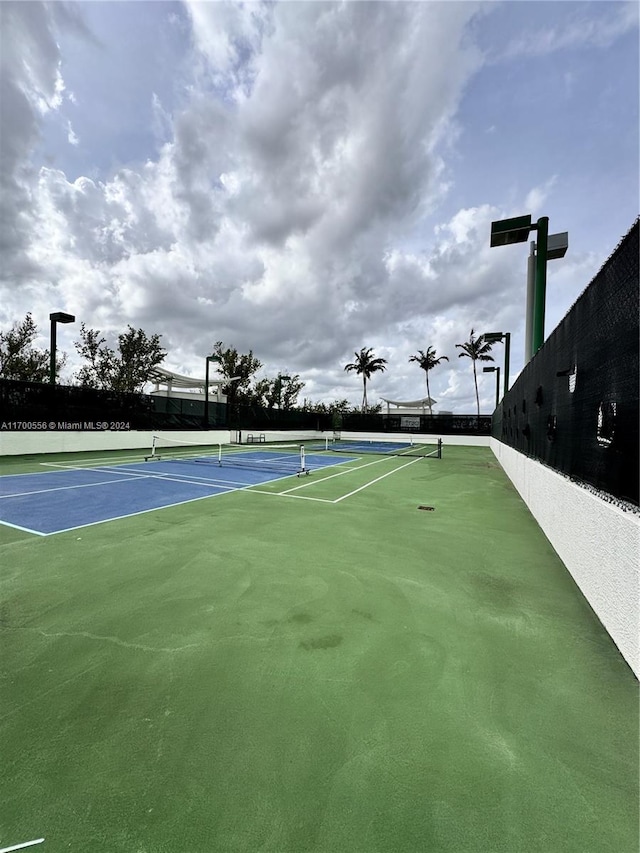 view of sport court featuring basketball hoop