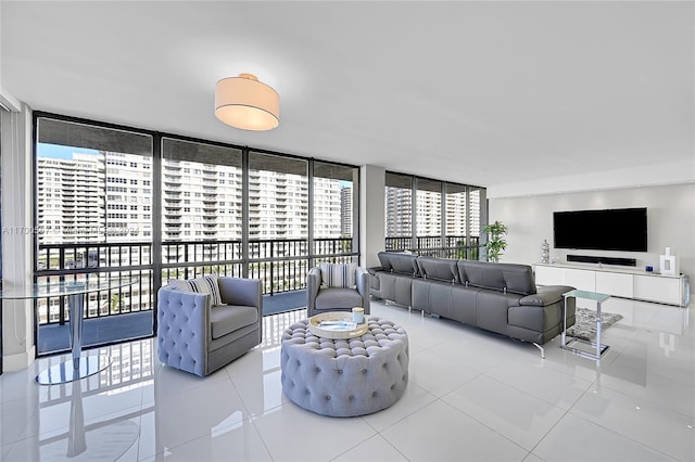 tiled living room featuring expansive windows and a wealth of natural light