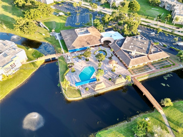 birds eye view of property with a water view