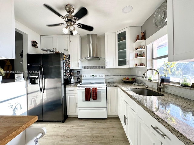 kitchen featuring black fridge with ice dispenser, white range with electric stovetop, sink, wall chimney range hood, and white cabinetry