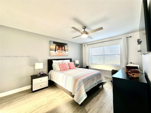 bedroom featuring ceiling fan and light hardwood / wood-style floors