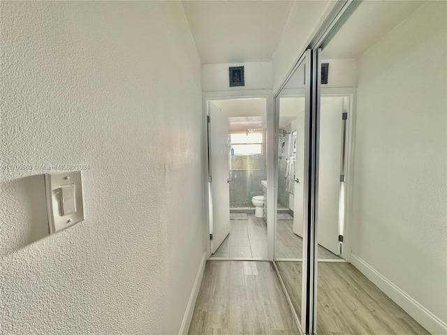 corridor featuring light wood-type flooring