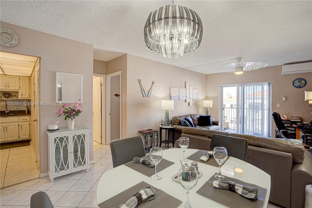 dining area featuring ceiling fan with notable chandelier, a textured ceiling, sink, light tile patterned floors, and an AC wall unit