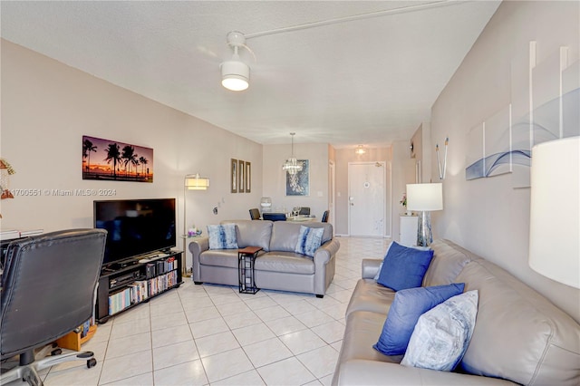 tiled living room featuring a textured ceiling