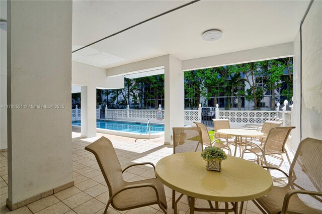 view of patio featuring a community pool