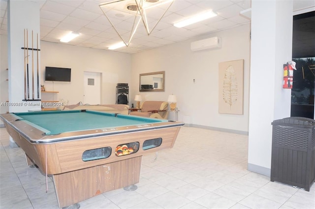 rec room with a drop ceiling, light tile patterned floors, a wall mounted air conditioner, and billiards