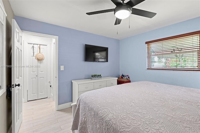 bedroom featuring light hardwood / wood-style flooring and ceiling fan