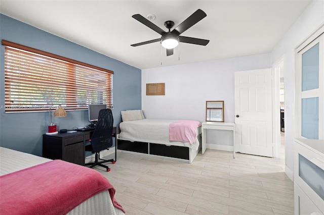 bedroom featuring light hardwood / wood-style floors and ceiling fan