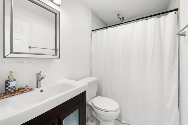 bathroom with toilet, vanity, and a shower with curtain