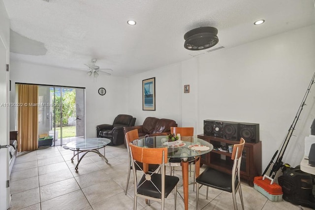 dining area featuring light tile patterned floors and ceiling fan