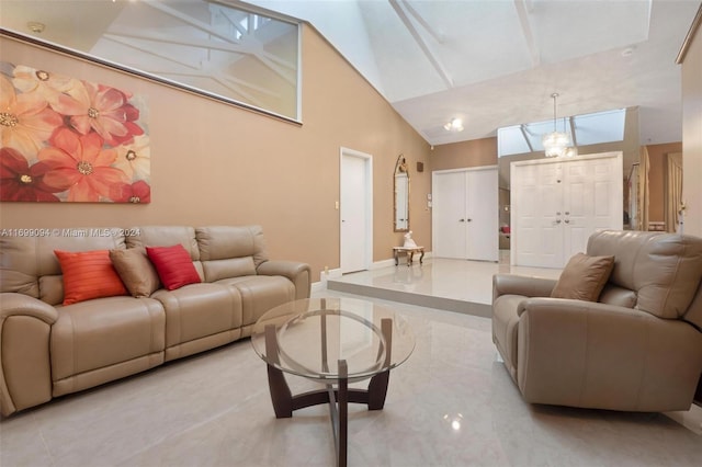 living room with high vaulted ceiling