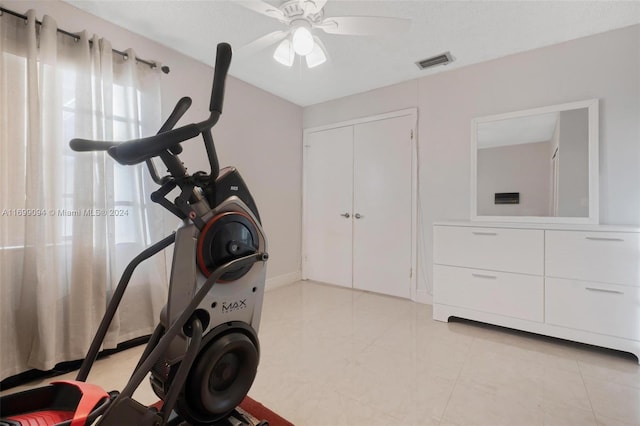 exercise room featuring ceiling fan