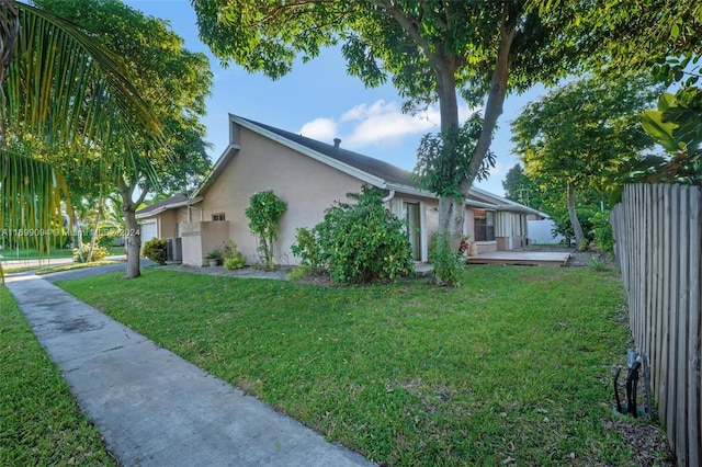 view of home's exterior with central AC unit and a lawn