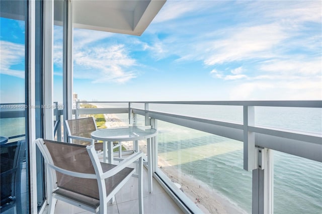 balcony featuring a water view