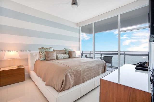 bedroom with ceiling fan, a wall of windows, and access to outside