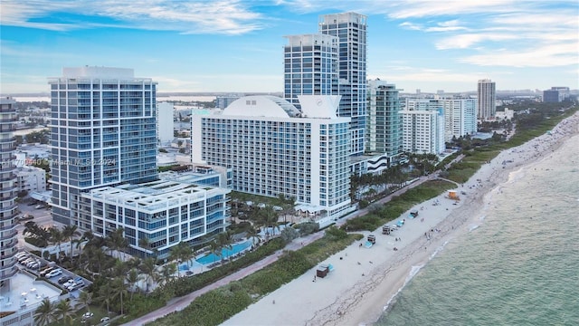 drone / aerial view with a view of the beach and a water view