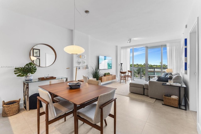 dining area with floor to ceiling windows