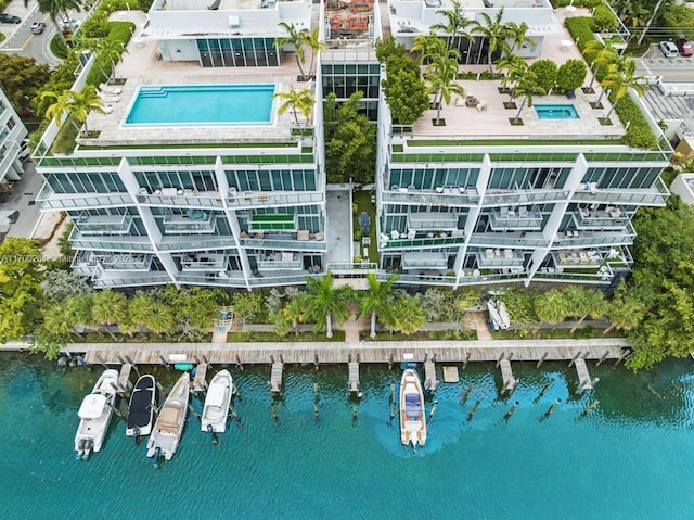 birds eye view of property with a water view