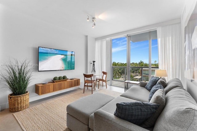 living room featuring floor to ceiling windows