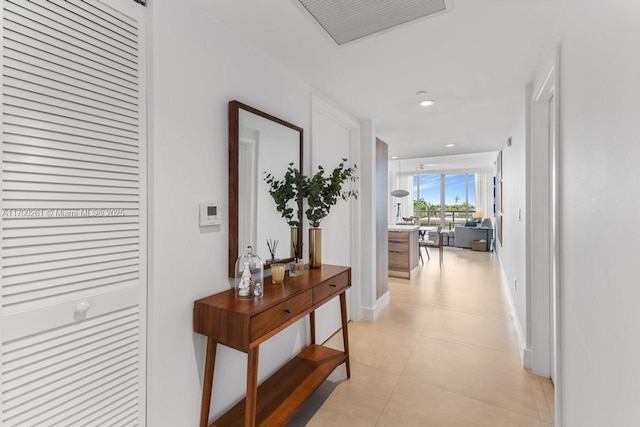 hallway with light tile patterned floors