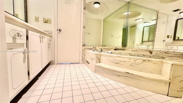 bathroom with vanity and tile patterned flooring